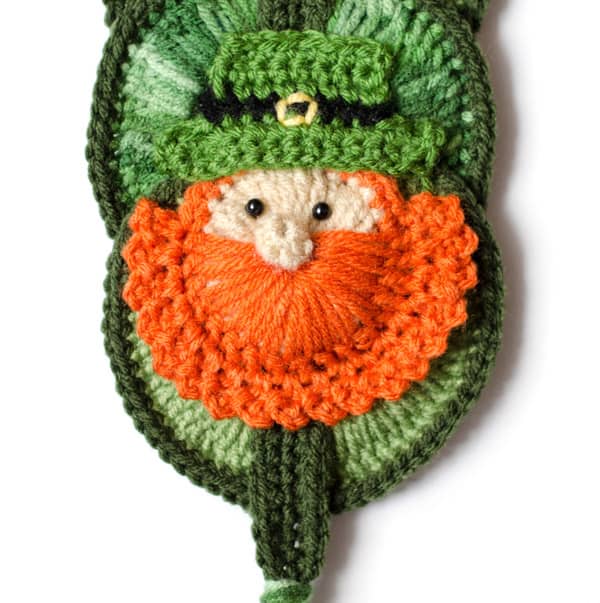 Crochet leprechaun wallhanging in green and orange