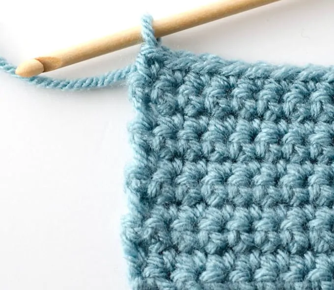 Blue single crochet sample with wood hook
