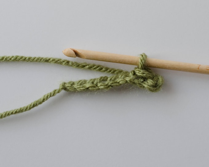 Green crochet chain with wood hook