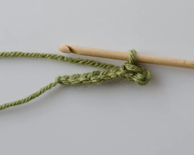 Green crochet chain with wood hook