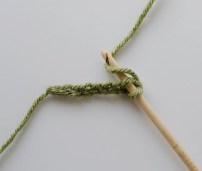 Green crochet chain with wood hook