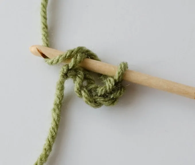 Joining together Green crochet chain with wood hook