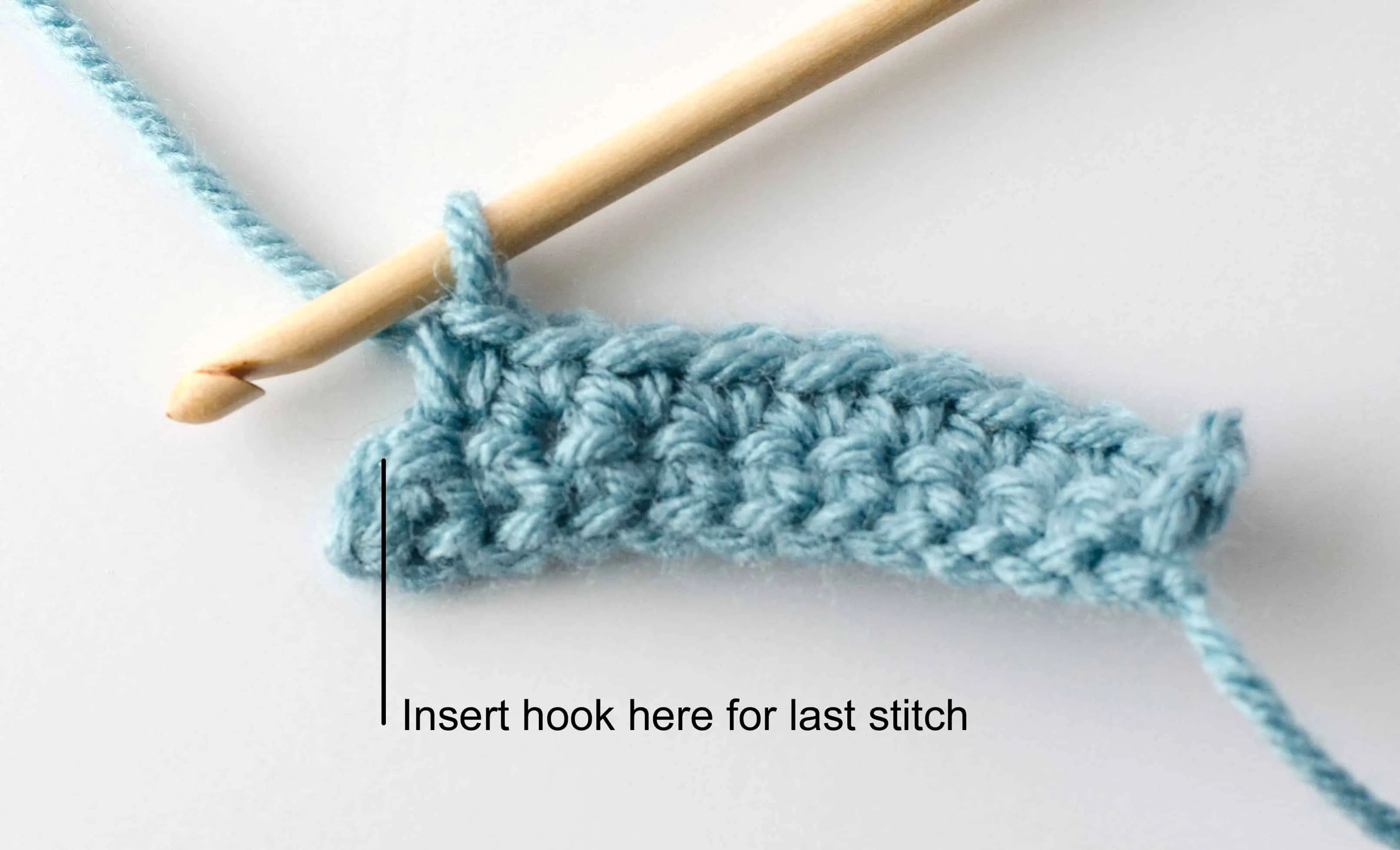 blue single crochet sample graphic with wood hook