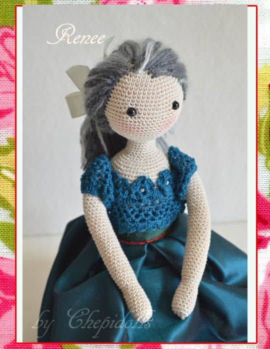 Crochet doll with gray hair and blue dress