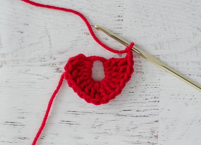 In progress red crochet heart with gold hook