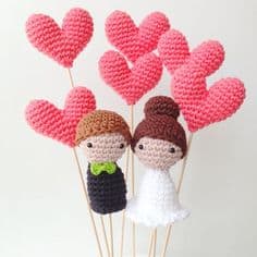 crochet bride and groom with crochet hearts