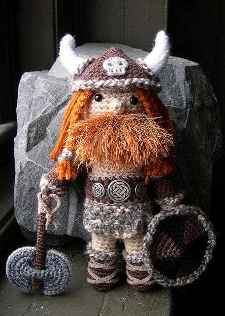 Crochet viking doll in orange and brown yarns