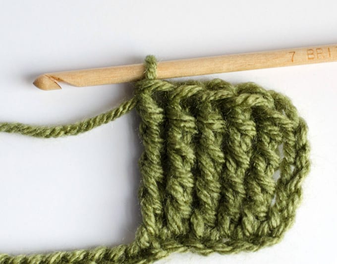 Triple Treble crochet stitch sample in green yarn