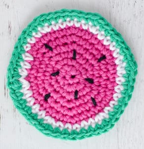 crochet watermelon coaster in pink, white and green