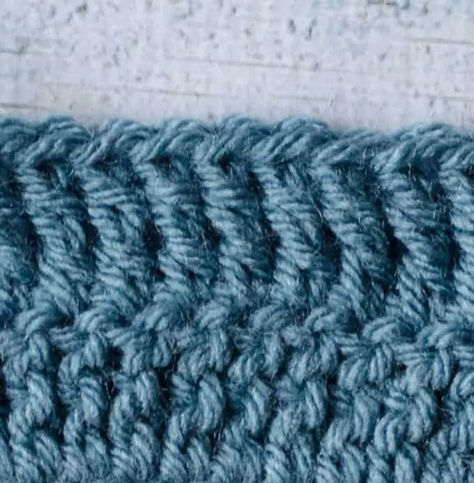 treble crochet stitches in blue yarn