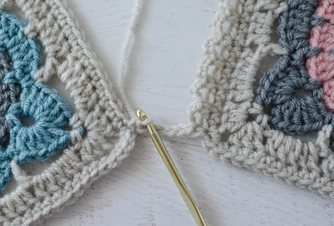 crochet pieces joined with yarn with gold hook
