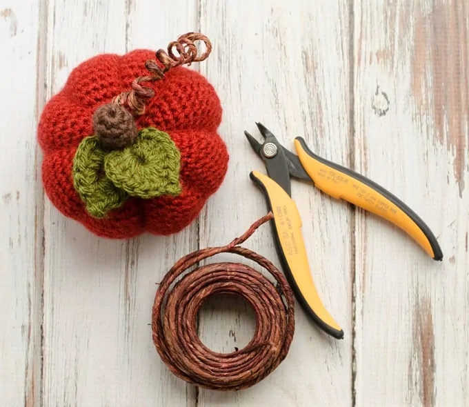 orange crochet pumpkin, florist wire and wire cutters
