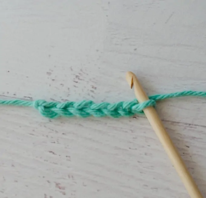 Green crochet chain with wood hook