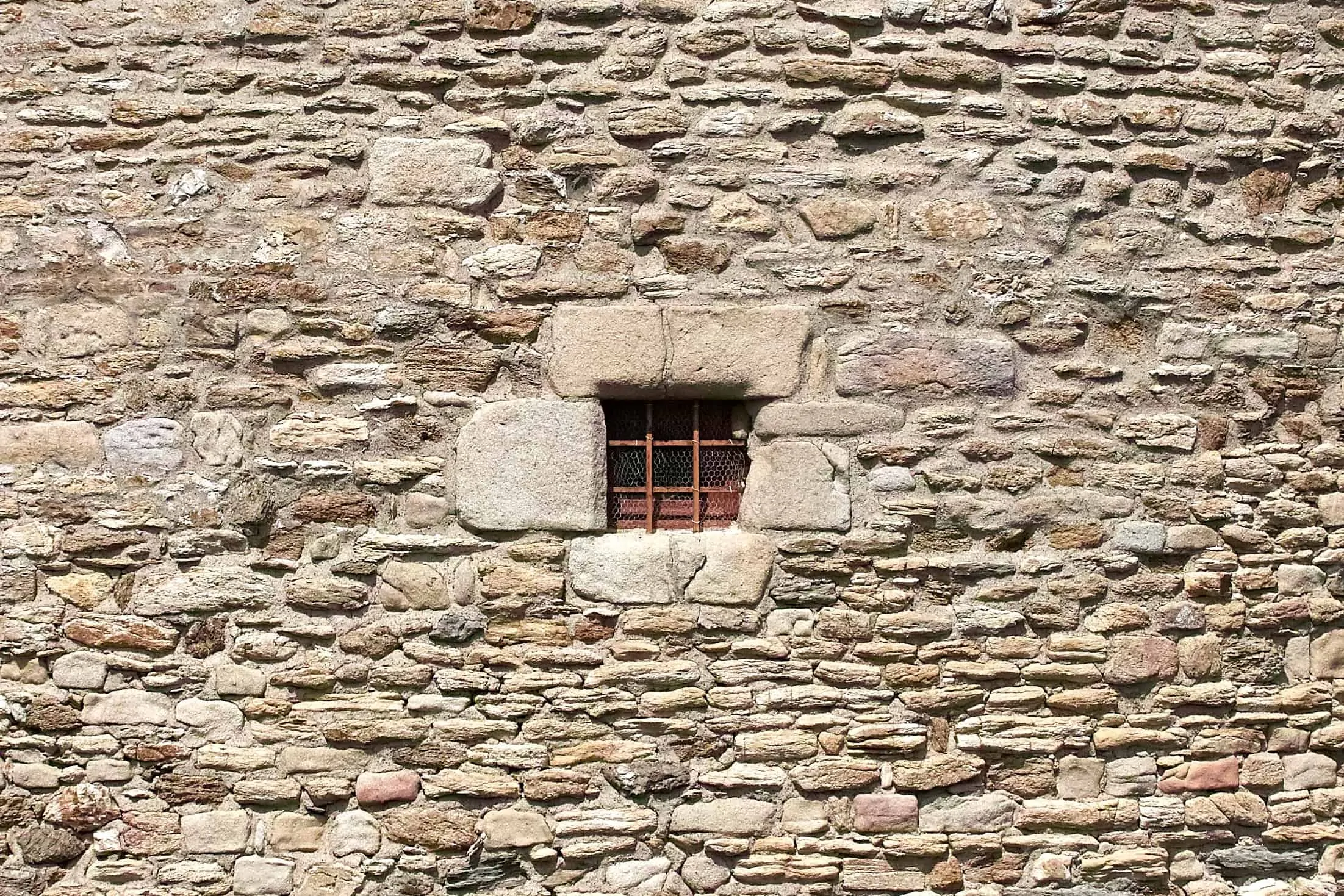 brick wall with small window