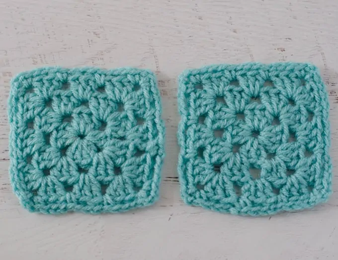 Two blue crochet granny squares