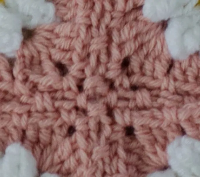 Corner of Crochet Faux Braid Join in pink yarn
