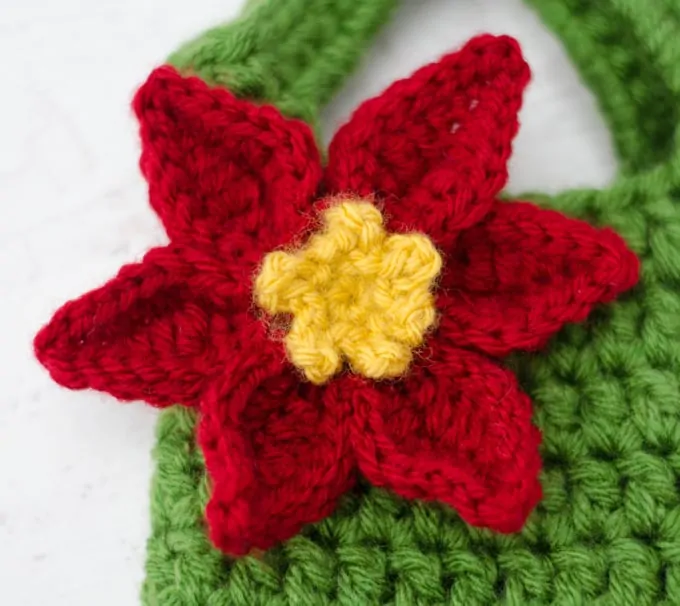 Crochet poinsettia wine cozy