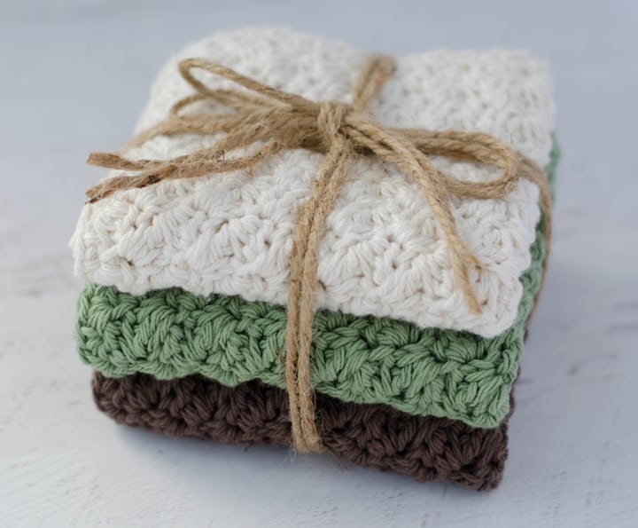 crochet dishcloths in ivory, green and brown