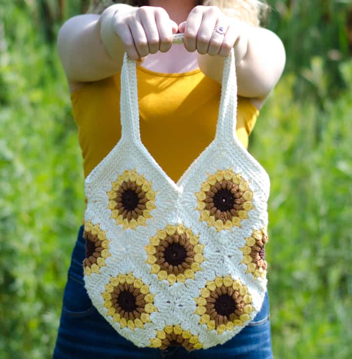 Girl holding crochet sunflower bag