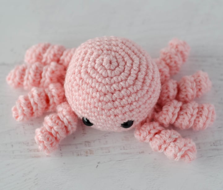 top view of pink crochet spider