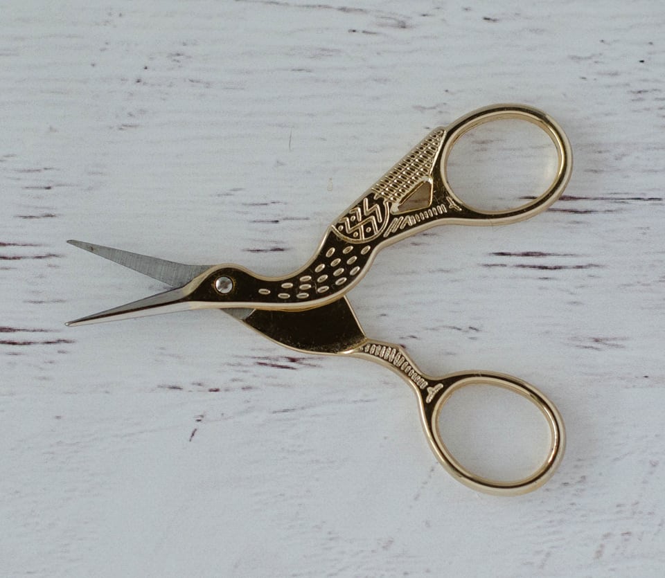 embroider scissors shaped like a stork