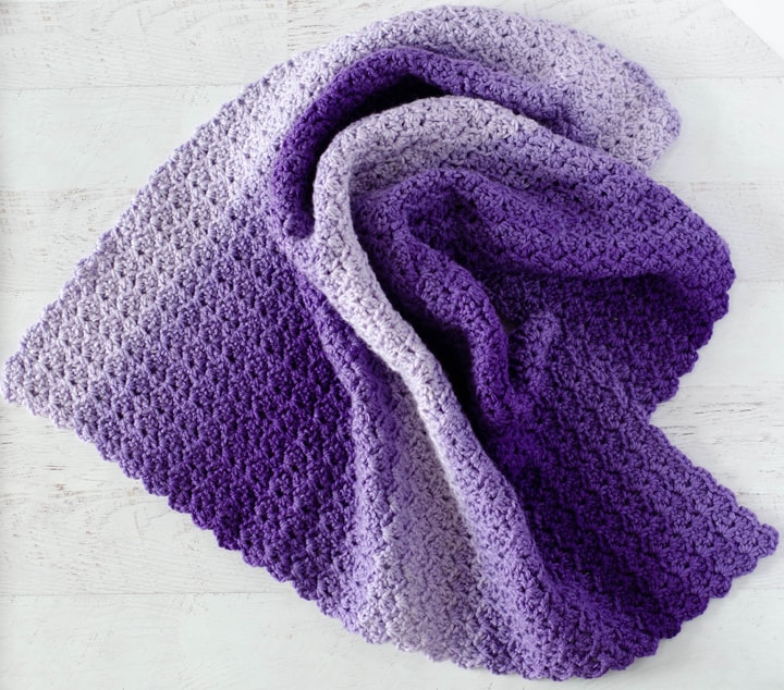Tulip Stitch Crochet Baby Afghan in purple yarn