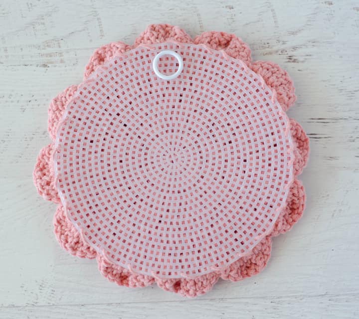 back of crochet flower with plastic canvas