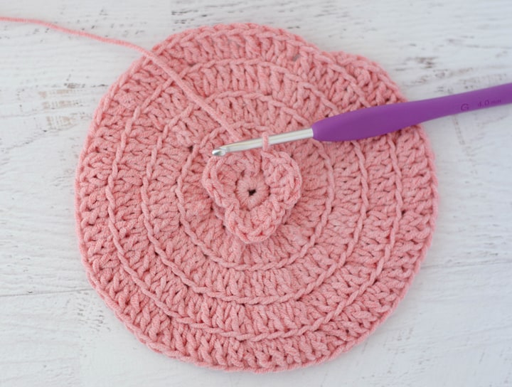 crochet flower petals on crochet circle