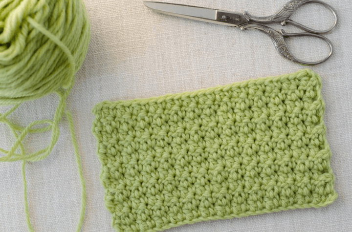 crochet stitch pattern in green yarn