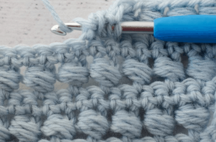 crochet stitch pattern in blue yarn