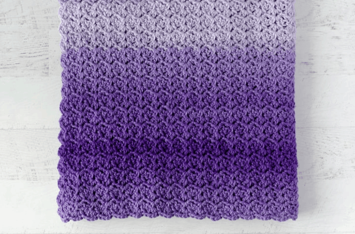 crochet stitch pattern in purple yarns