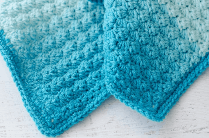 crochet stitch pattern in blue yarns