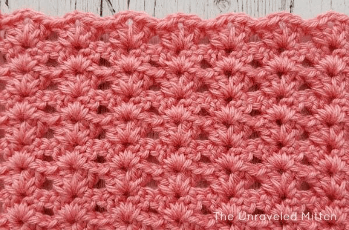 crochet stitch pattern with coral color yarn