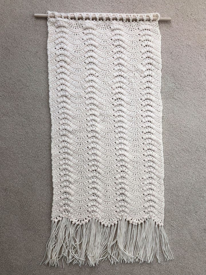 crochet wallhanging on floor