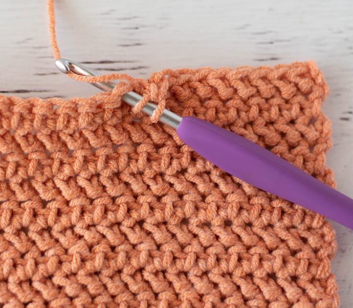 orange stitch sample of herringbone half double crochet