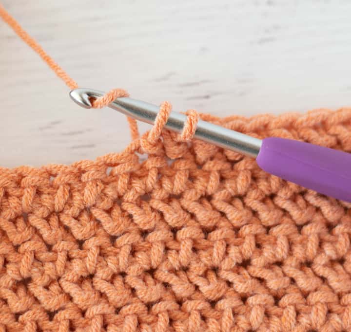 close up view of last step in making herringbone half double crochet stitch