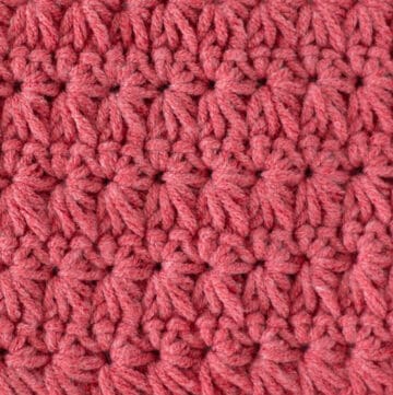close up coral color yarn in crochet star stitch