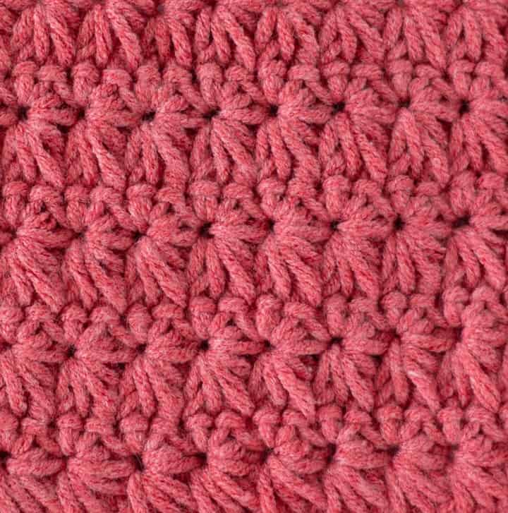 close up coral color yarn in crochet star stitch