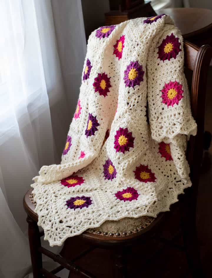lacy crochet afghan on a chair