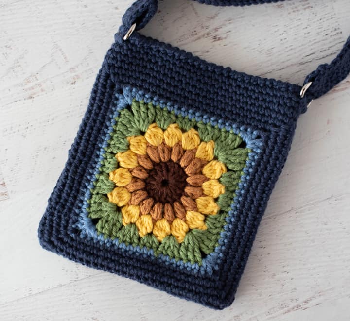 Blue crochet bag with yellow sunflower