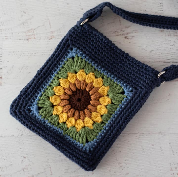 Blue crochet bag with yellow sunflower