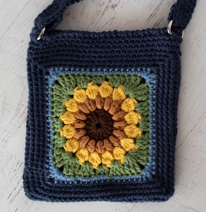 Blue crochet bag with yellow sunflower