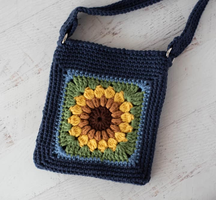 Blue crochet bag with yellow sunflower