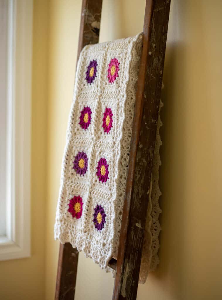crochet afghan on a ladder