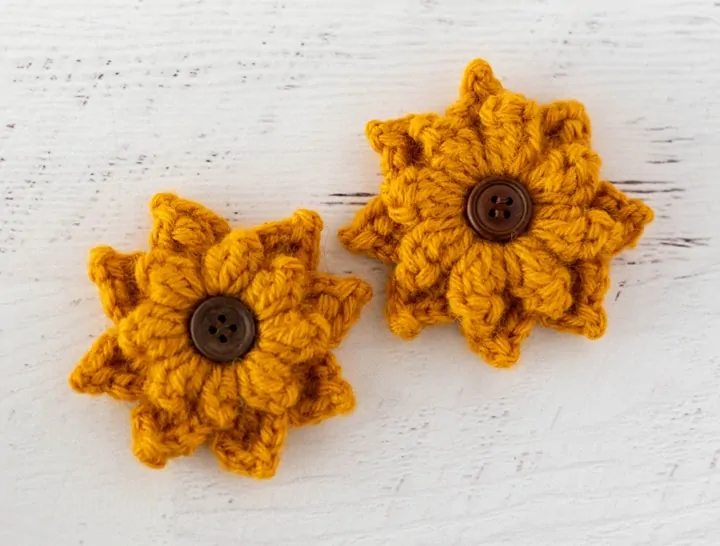 Black Eyed Susan crochet flowers in yellow yarn with brown button centers