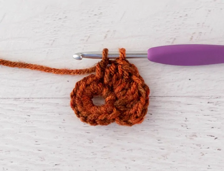 crochet cluster stitch out of orange yarn