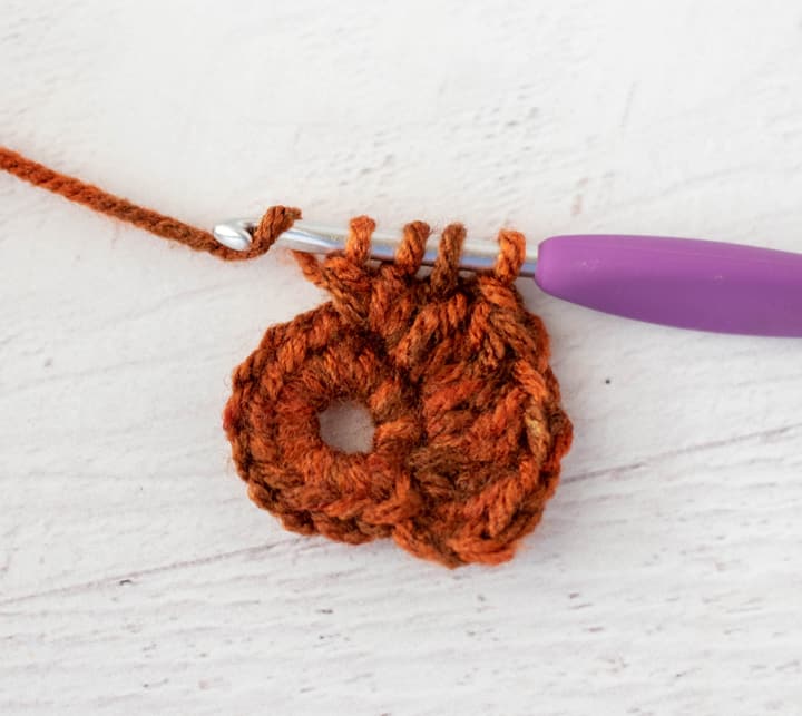 crochet cluster stitch out of orange yarn