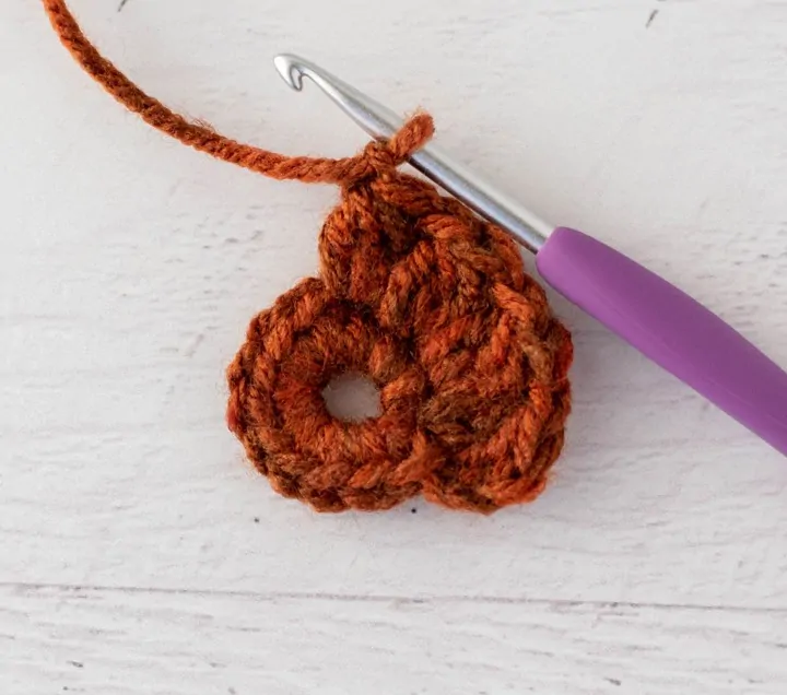 crochet cluster stitch out of orange yarn