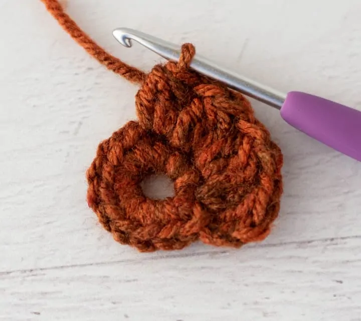 crochet cluster stitch out of orange yarn