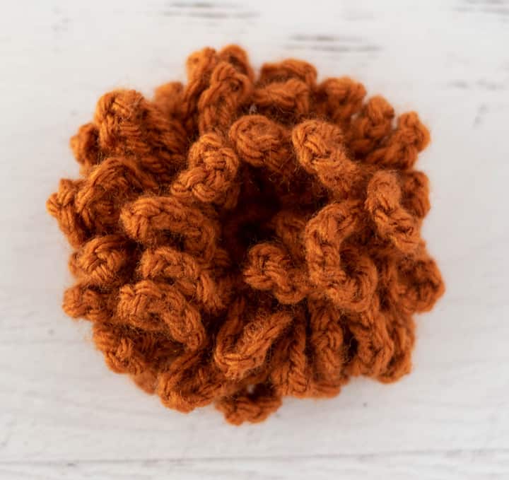 rust color loopy crochet flower